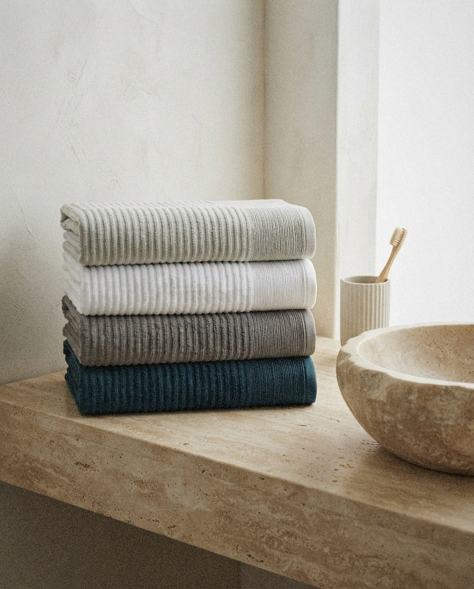Pidada Hand Towel Set in a calm spa style bathroom setting