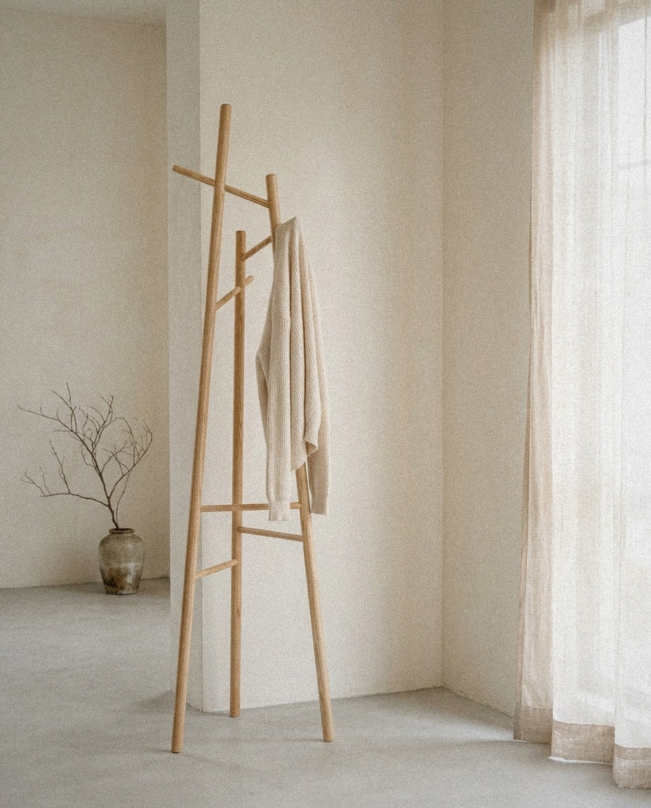 Ash Wood Coat Rack styled in a minimal, sunlit room