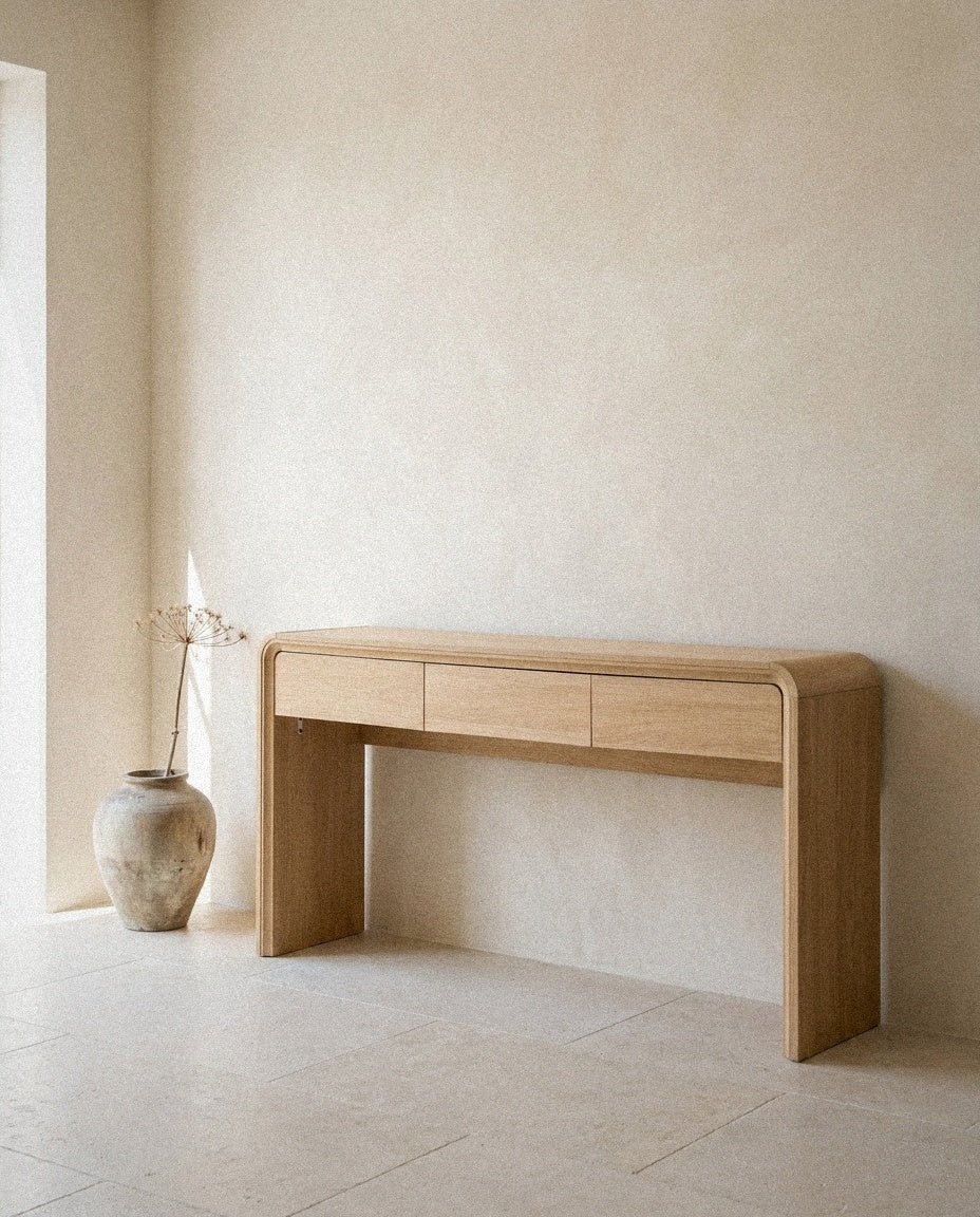 Curved 3-Drawer Console Table, 63 Inch in a light organic modern interior