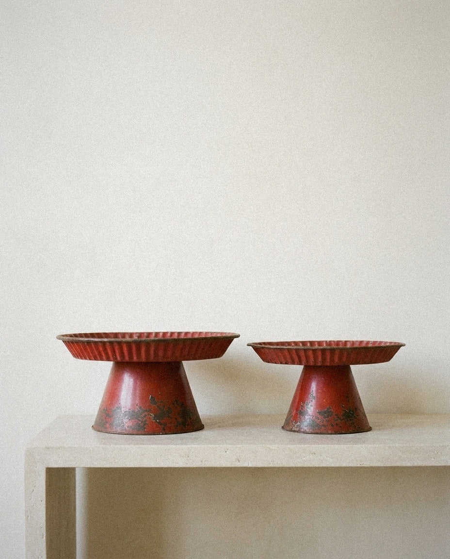 Decorative Metal Pedestals -Distressed Red Finish in a light organic modern interior