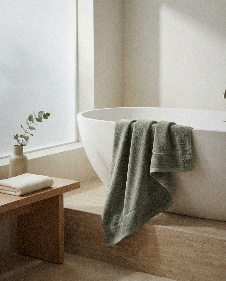 Deia Cotton Bath Towels in a calm spa style bathroom setting