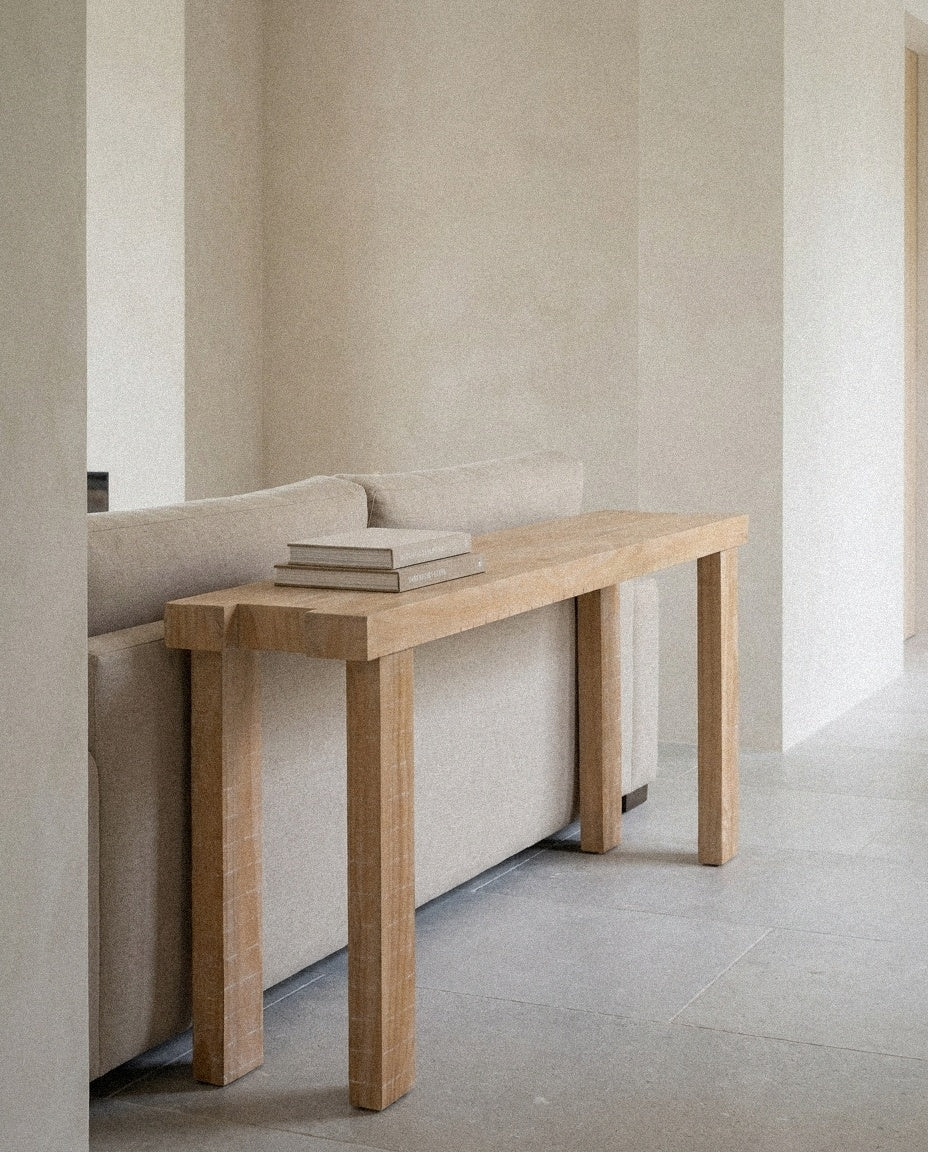 Long Narrow Console Table styled in a minimal, sunlit room