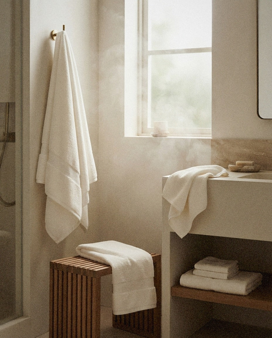 Organic 6-Piece Bath Towel Set detail in a warm minimalist bathroom