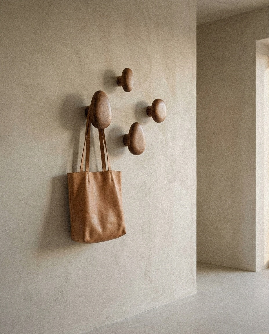 Minimalist Wooden Pebble Wall Hook Set (4pcs) styled in a minimal, sunlit room
