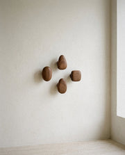 Minimalist Wooden Pebble Wall Hook Set (4pcs) in a light organic modern interior