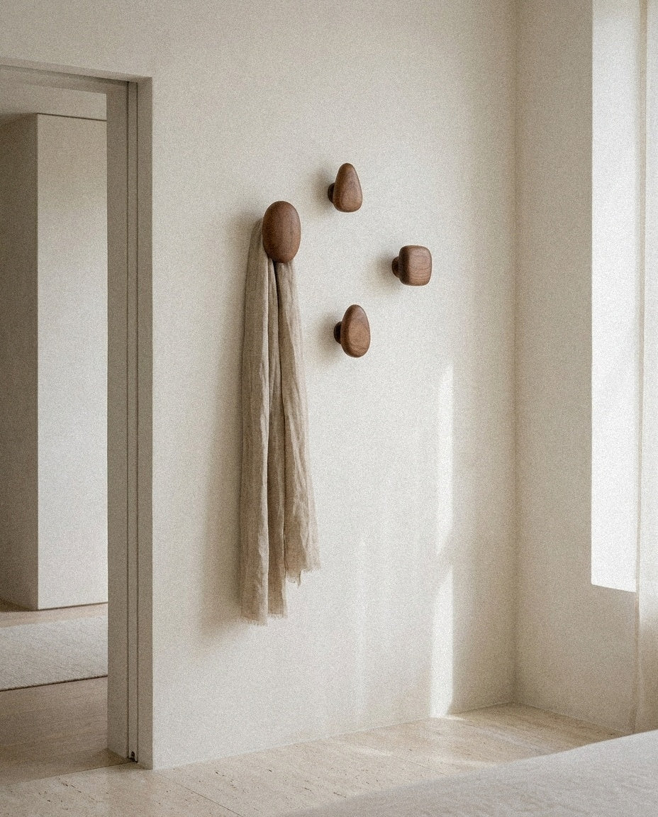 Minimalist Wooden Pebble Wall Hook Set (4pcs) styled in a minimal, sunlit room
