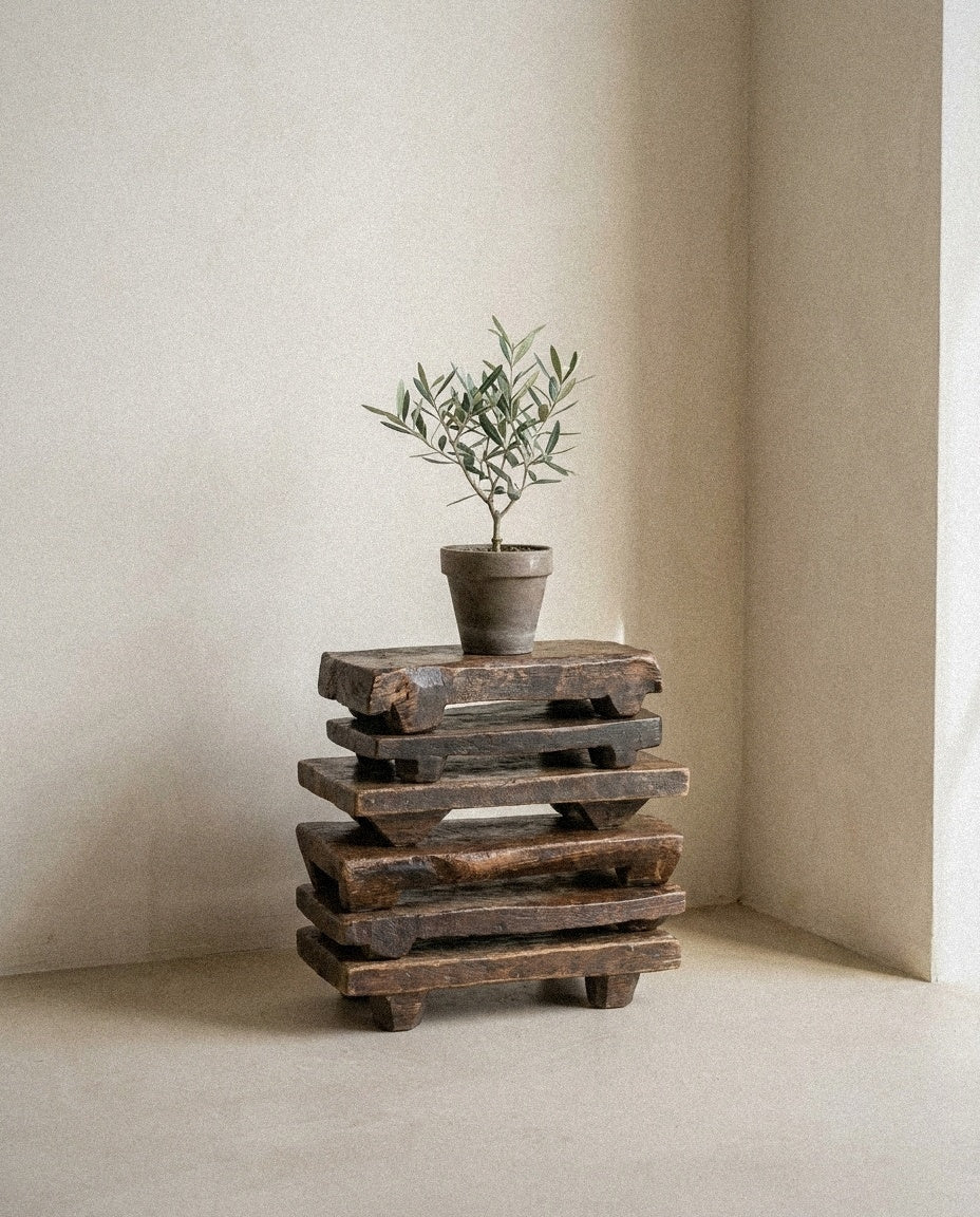 Primitive Wood Stackable Pedestal styled in a minimal, sunlit room