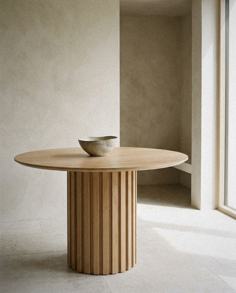 Senja Round Dining Table styled in a minimal, sunlit room