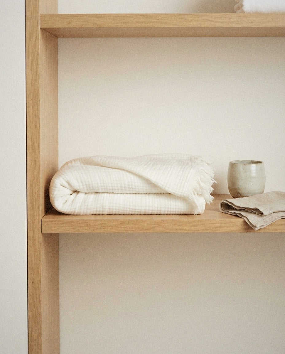Strand Bath Towel detail in a warm minimalist bathroom