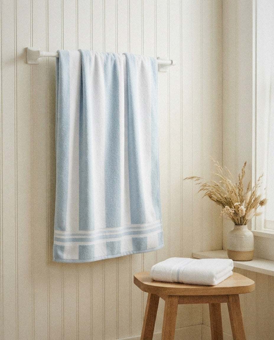 Cabana Striped Beach Towel detail in a warm minimalist bathroom