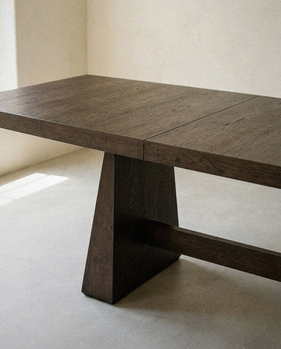 Close-up of Tauren - Extendable Double Pedestal Dining Table - Coffee Bean showing material and construction