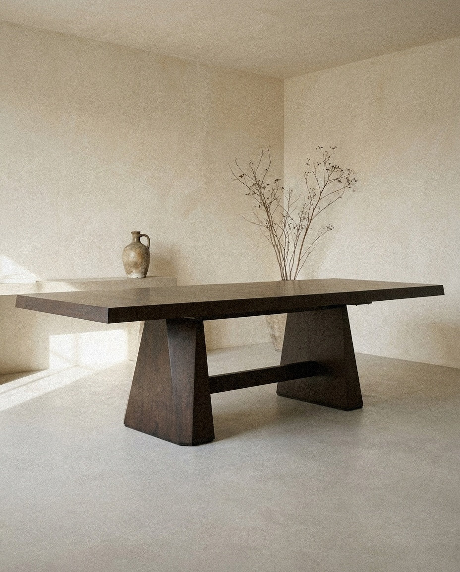Tauren - Extendable Double Pedestal Dining Table - Coffee Bean styled in a minimal, sunlit room