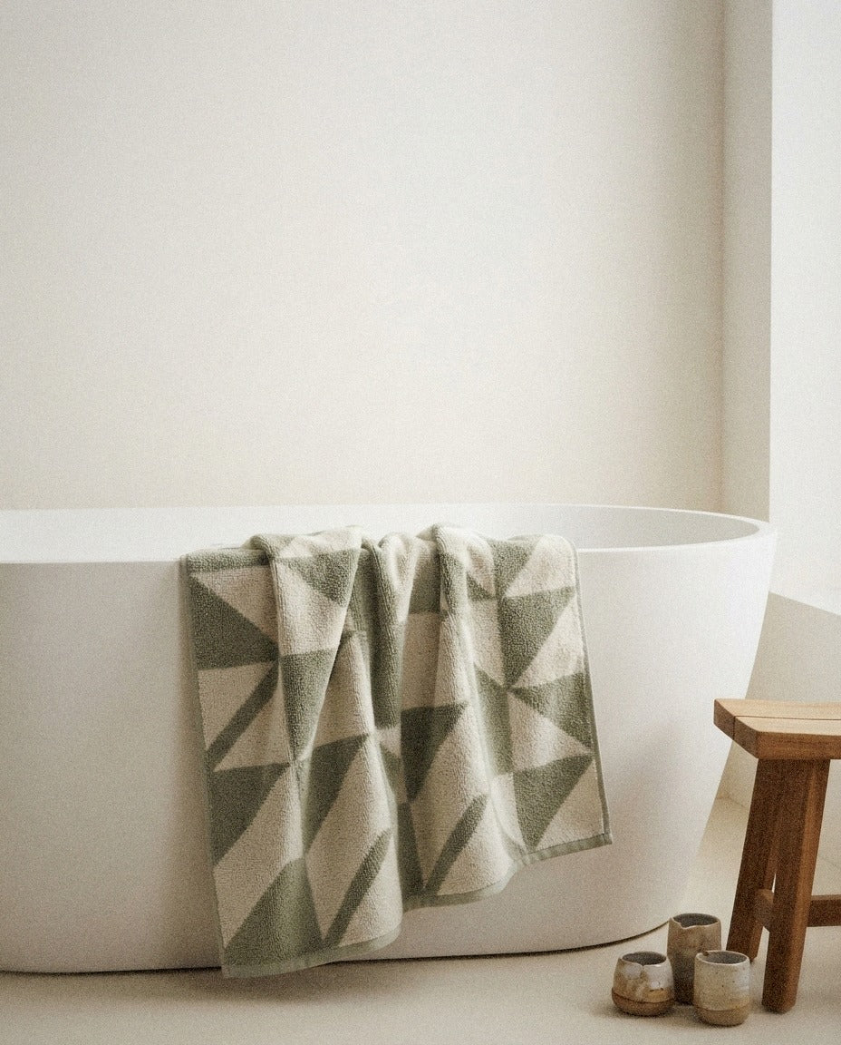 Umbra Cotton Bath Towels in a calm spa style bathroom setting