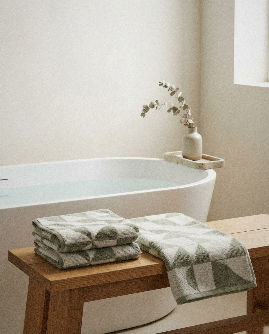 Umbra Cotton Bath Towels detail in a warm minimalist bathroom