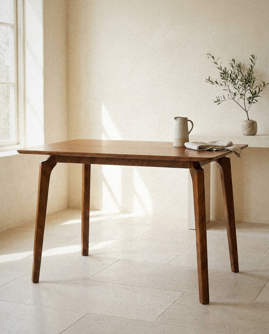 Verve Solid Wood Dining Table styled in a minimal, sunlit room