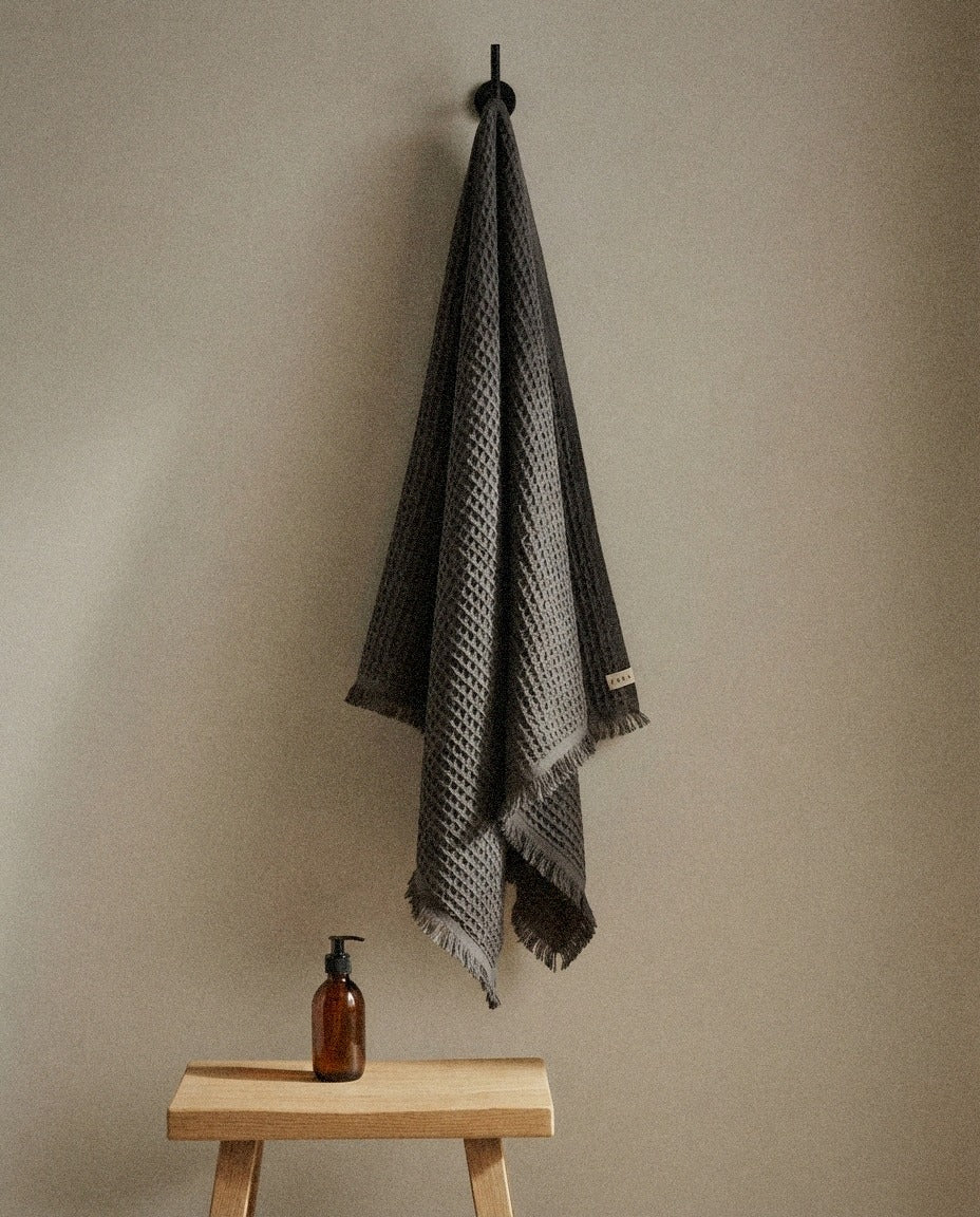 Turkish Waffle Bath Towel detail in a warm minimalist bathroom