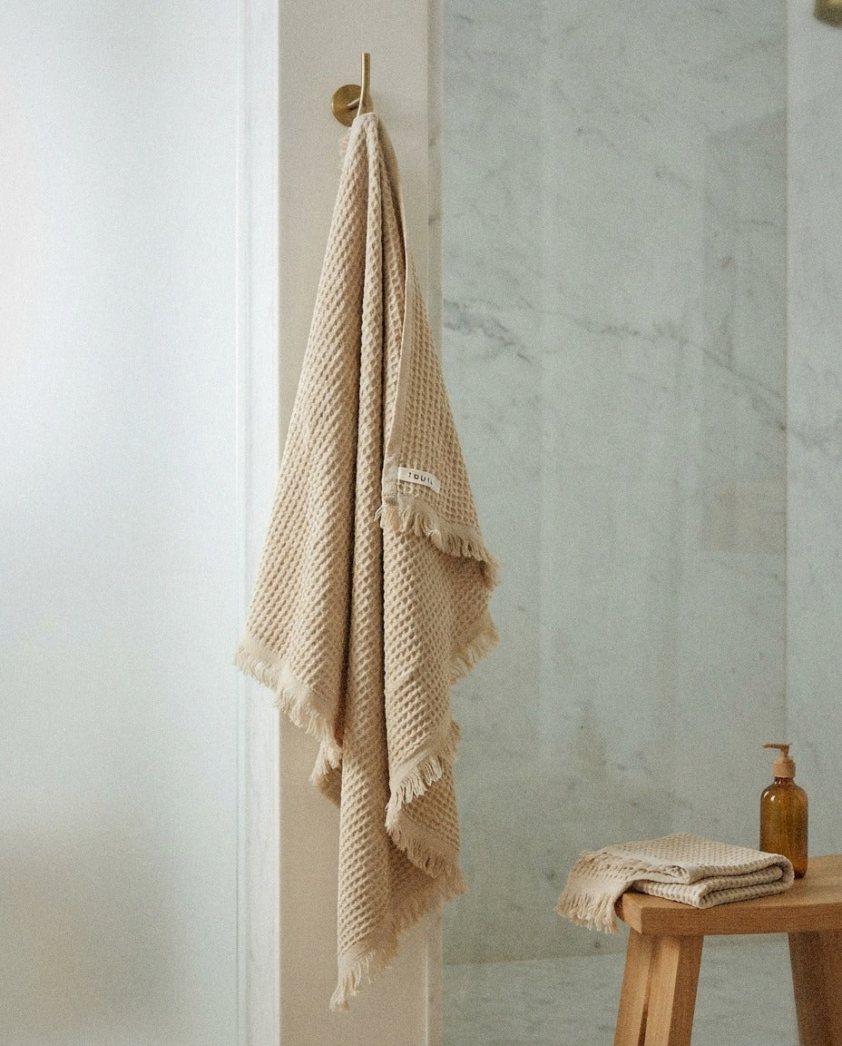Turkish Waffle Bath Towel – Sand in a calm spa style bathroom setting