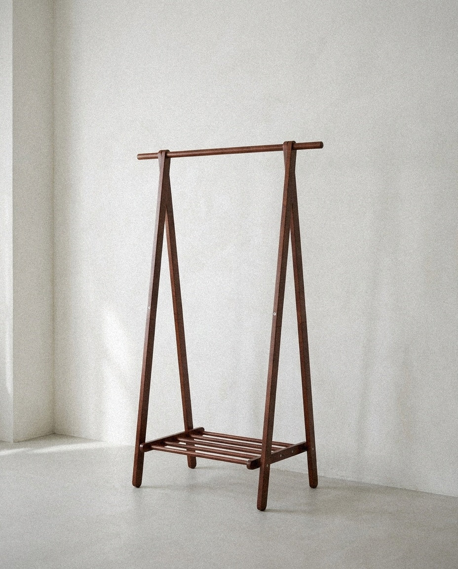 Walnut Folding Garment Rack in a light organic modern interior