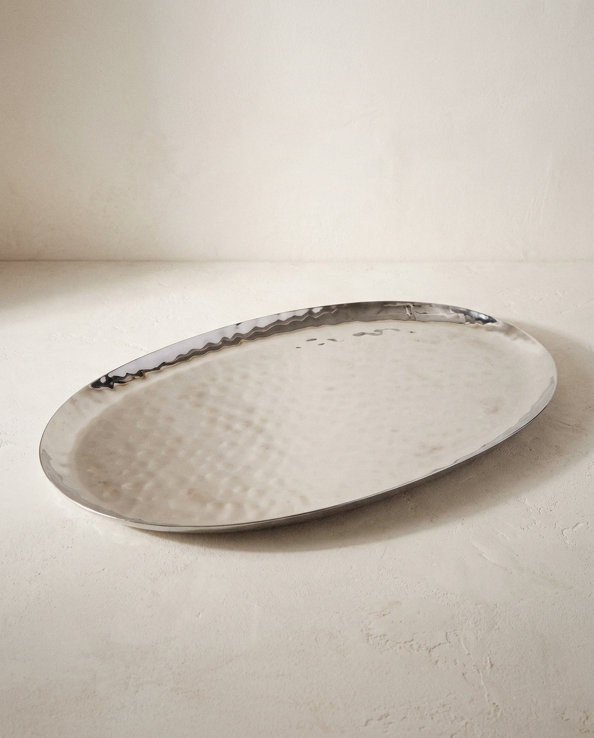 Polished Steel Oval Serving Tray in a bright organic modern interior