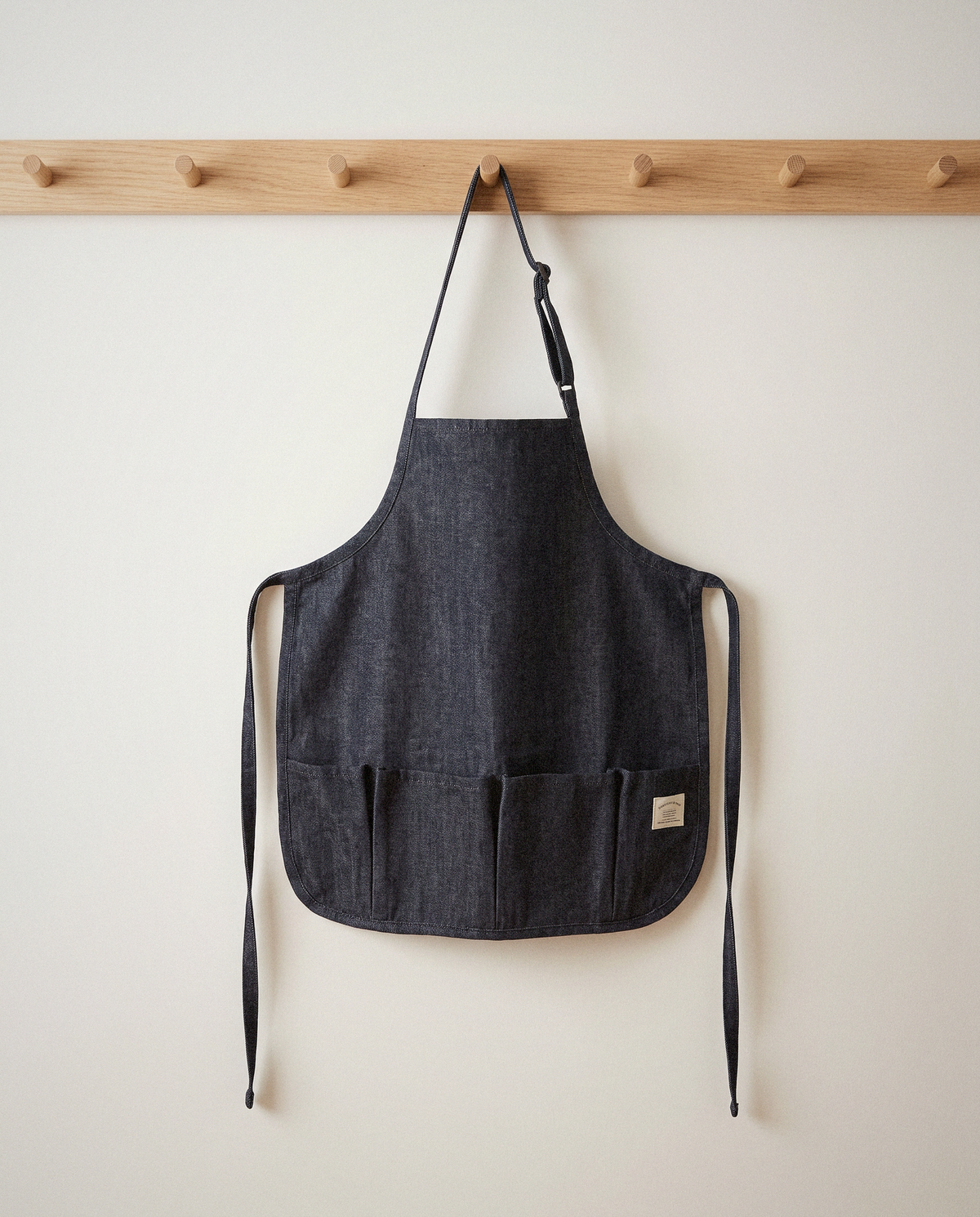 Kids Canvas Apron styled in a calm minimalist living space