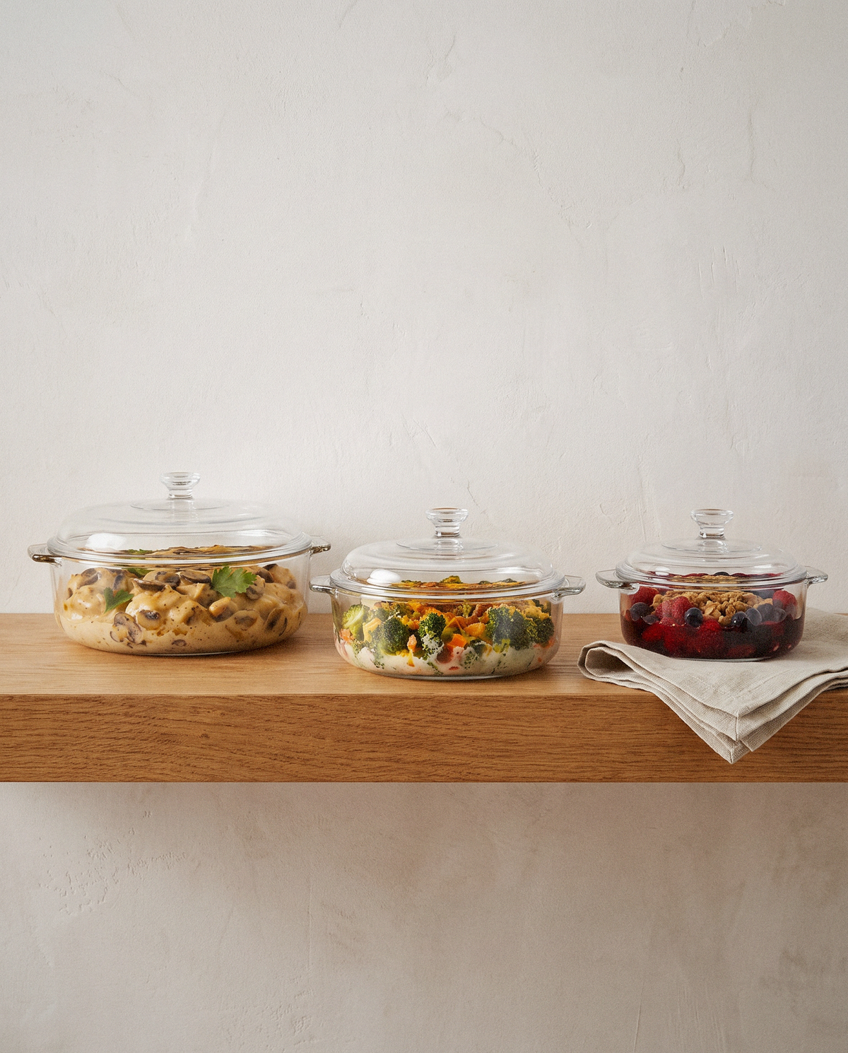 Glass Casserole Set with Lids, 6 Piece detail in warm natural light