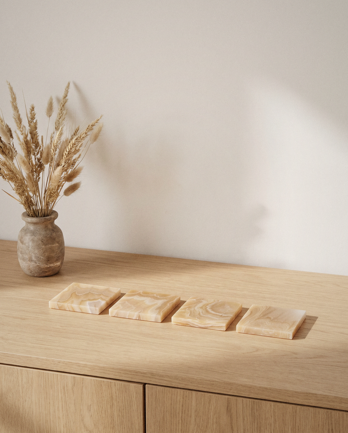 Honey Onyx Coasters styled in a calm minimalist living space