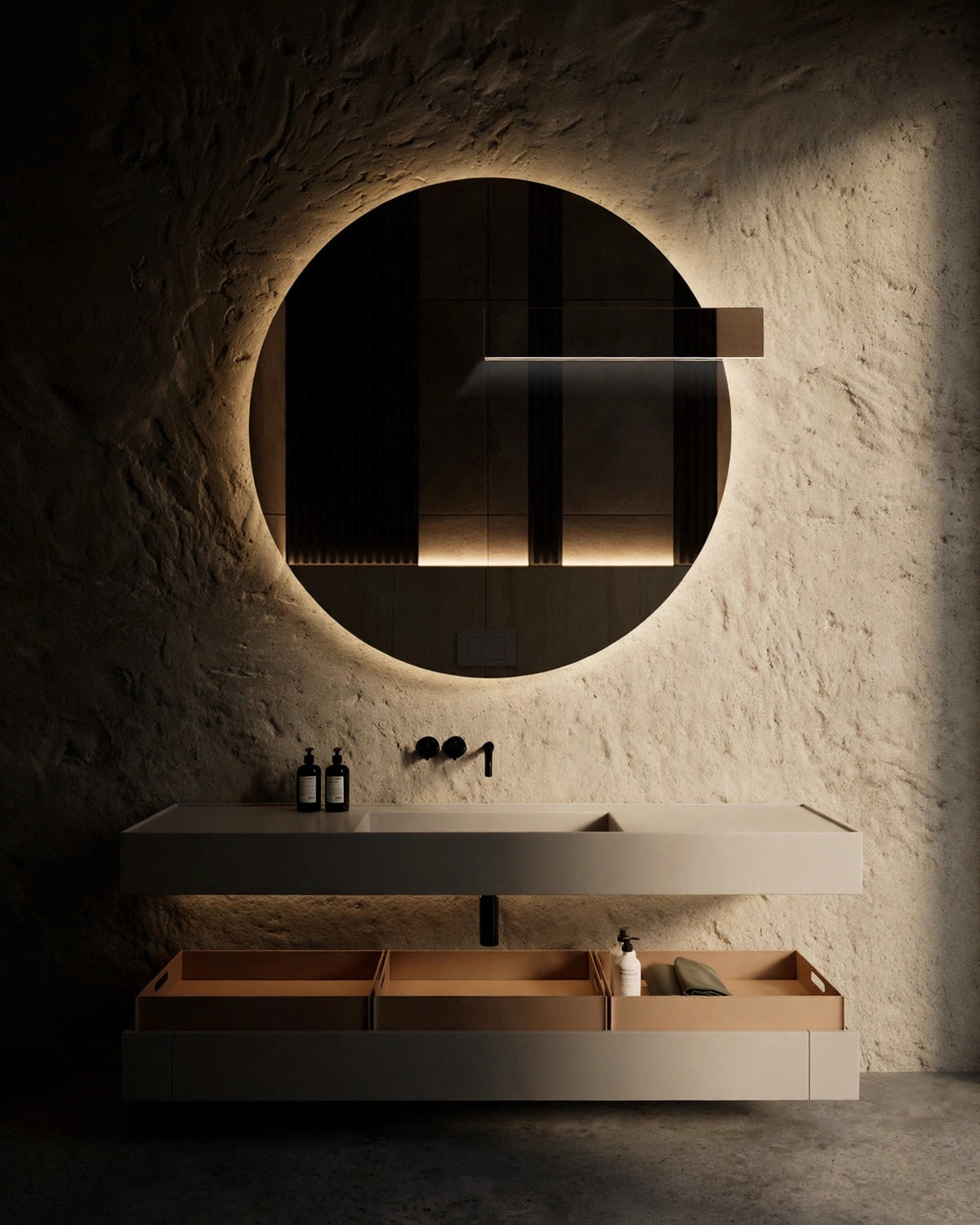 Round LED bathroom mirror in organic modern interior, moody chiaroscuro light, editorial still life