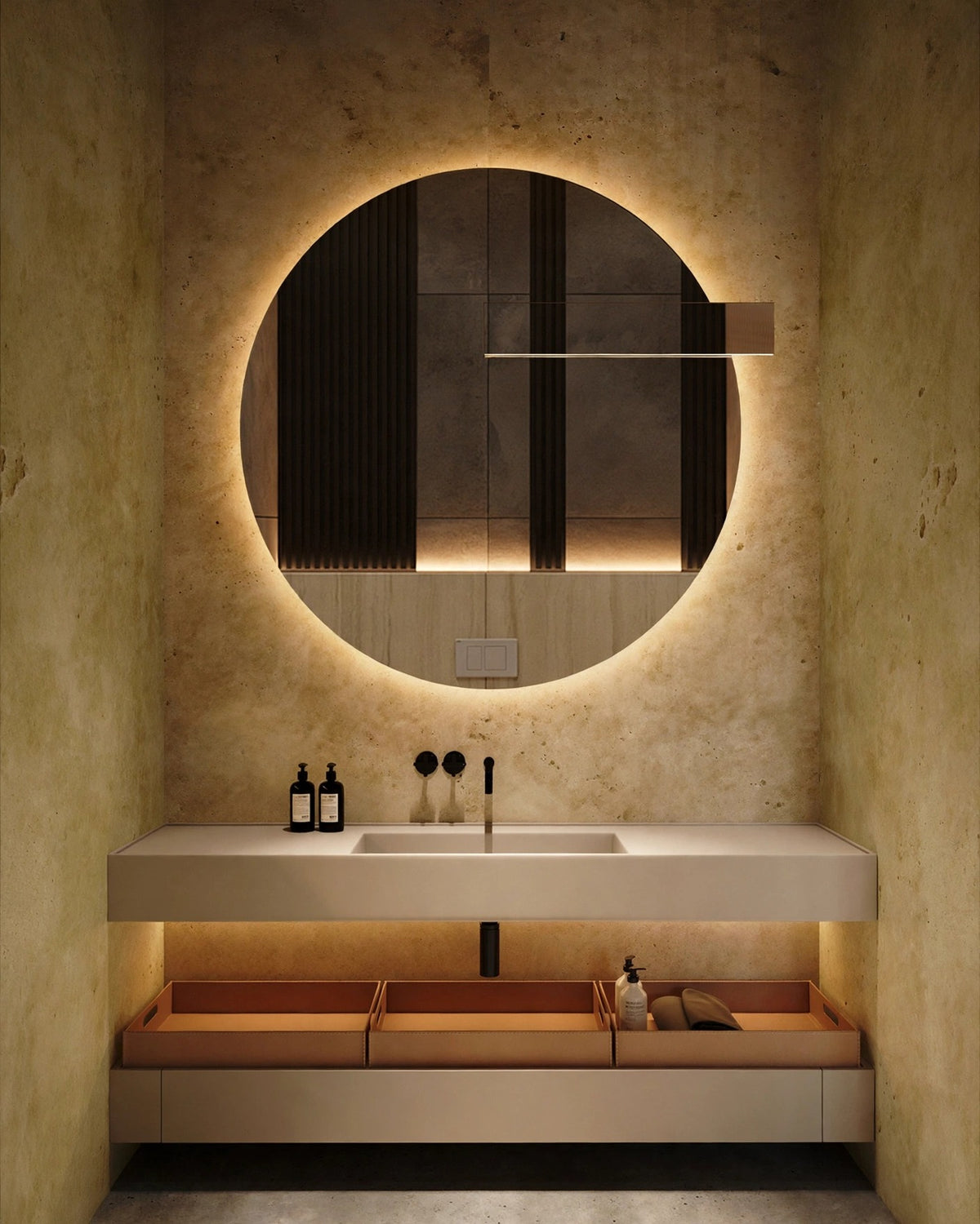 Round LED bathroom mirror in organic modern interior, warm tungsten evening light, editorial still life
