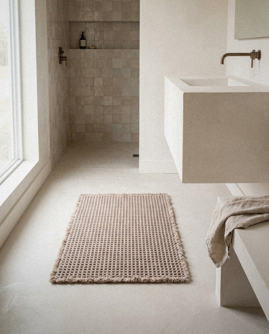 Siena taupe waffle bath mat with fringe in a bathroom with handmade zellige tiles